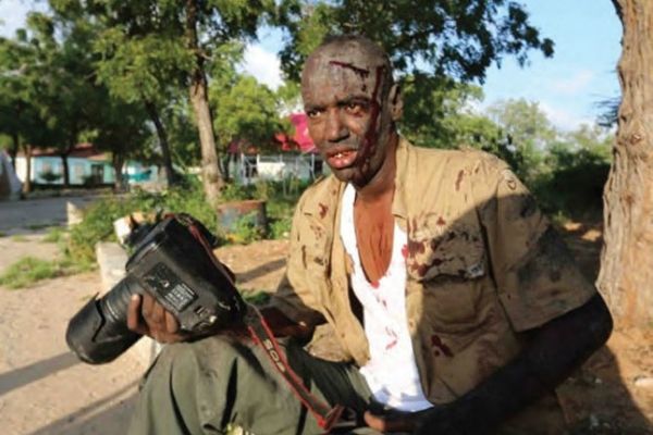 Wounded photographer In the Eye of the Storm Journalists' commemorative service