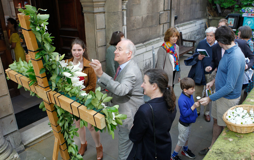 Decorating Easter cross with daffodils