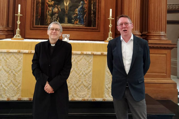 Christopher Betterton and Canon Alison Joyce exchange farewells on the St Bride's altar steps