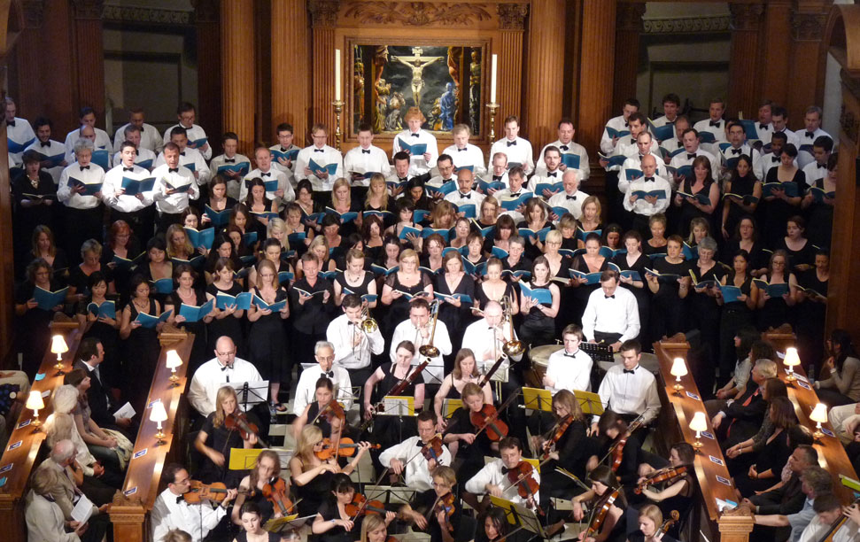 EC4 Music choir and Orchestra performing a concert at a packed St Bride's