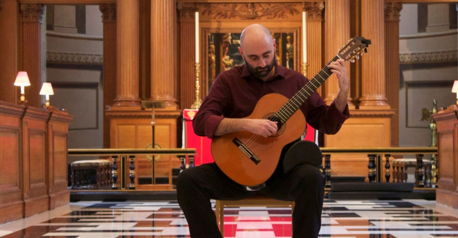 Guitarist Stelios Kyriakidis playing in front of St Bride's altar