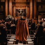 St Bride's Choir singing in darkened church at Spectator Carol Service