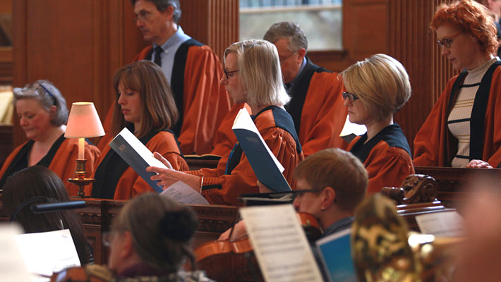 Singers in St Bride's Choir performing with orchestra