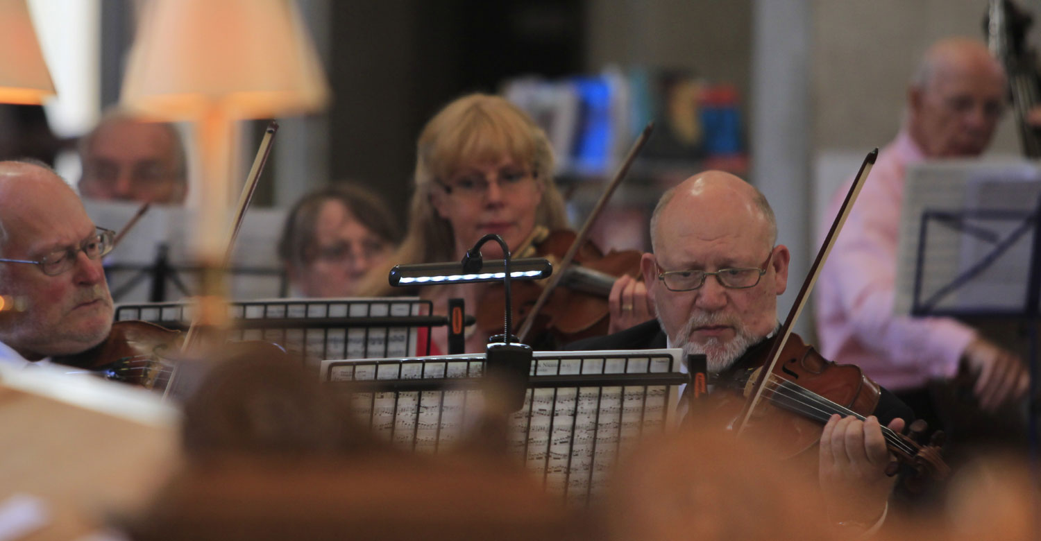 violinists playing in orchestra at St Bride's