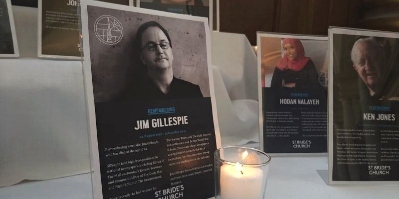 Memorial plaque for Jim Gillespie next to candle