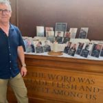 John McCarthy stands in front of Journalists' Altar at St Bride's
