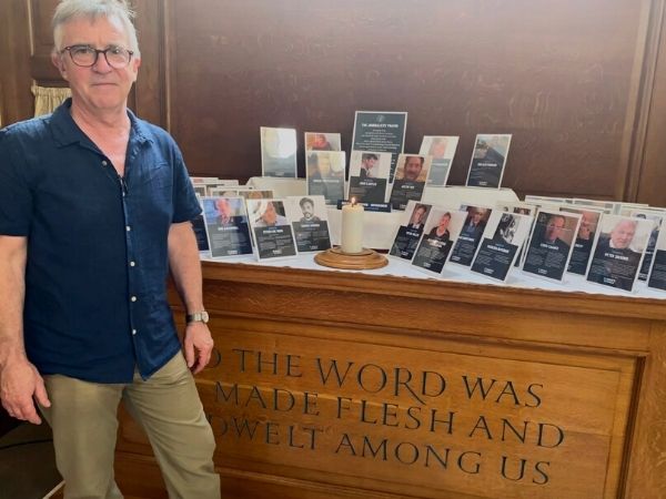 John McCarthy stands in front of Journalists' Altar at St Bride's