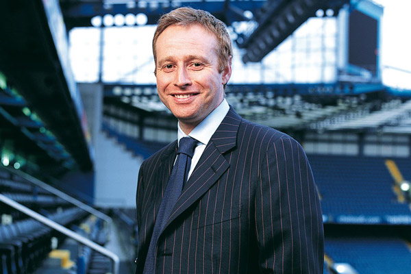 Simon Greenberg standing in the seating area of Chelsea FC