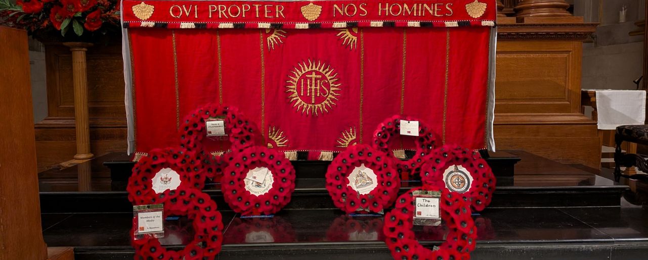 Poppy wreaths on the altar steps of St Bride's Church
